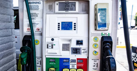 Fuel pump dispenser showing price display with diesel and unleaded options.