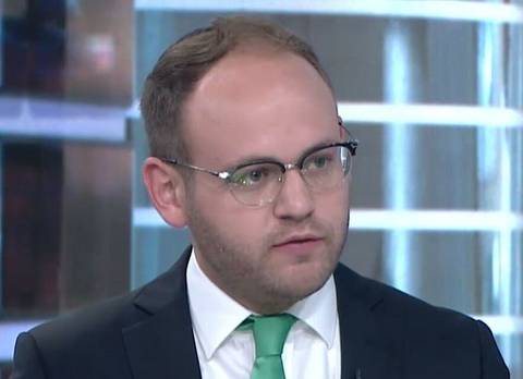 File image: Man in glasses and green tie presenting in broadcast studio setting