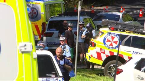 Australian emergency services at street incident scene with ambulances and uniformed responders