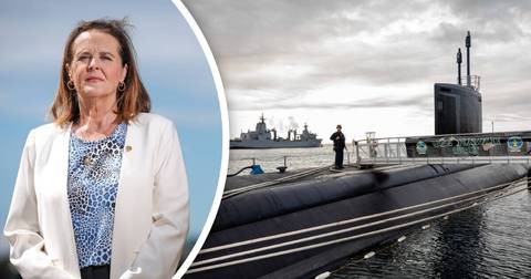 Woman in white blazer beside naval ship and submarine imagery