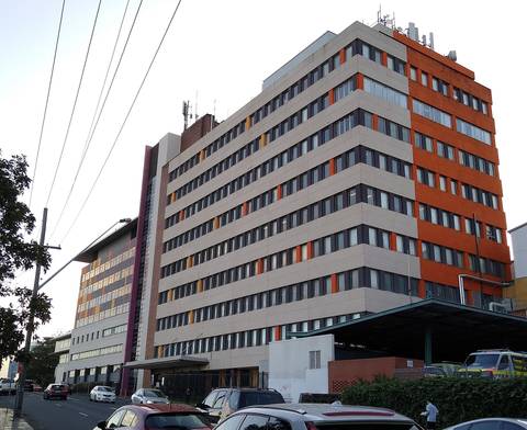 File image: Multi-storey hospital building exterior with orange and cream facade