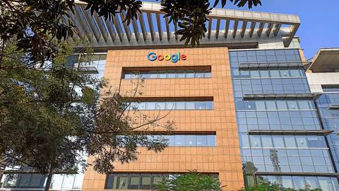 File image: Google office building with orange brick facade and prominent Google logo.