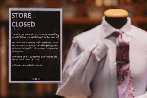 File image: Closed fashion boutique with COVID-era closure notice and mannequin