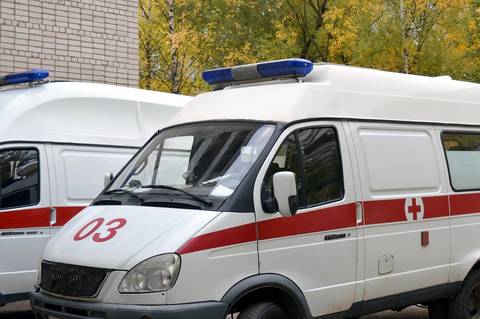 File image: White and red ambulance vehicle with emergency markings and medical cross symbol.