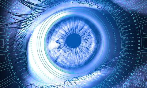 File image: Blue glowing digital eye with technology and circuit patterns