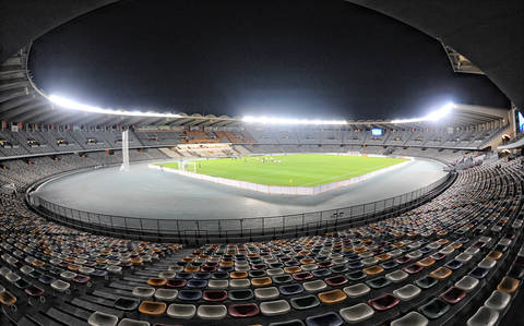 File image: Large stadium at night with floodlights and empty seats