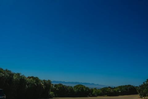 File image: Clear blue sky over scrubland with distant mountain silhouette