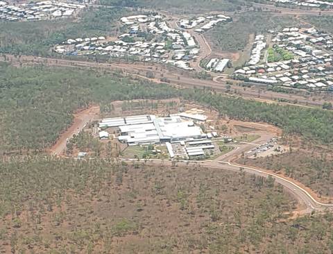 File image: Aerial view of large institutional building complex in Australian scrubland