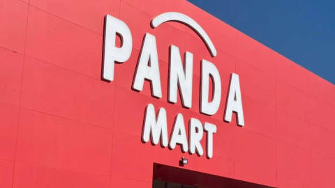 Panda Mart storefront sign in white 3D lettering on red facade