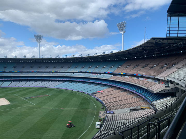File image: Empty MCG stadium with maintenance vehicle on field
