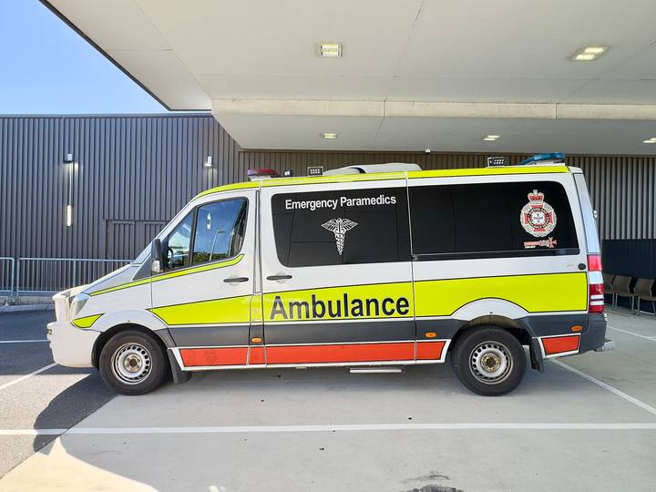 File image: White and yellow Australian Emergency Paramedics ambulance at medical facility