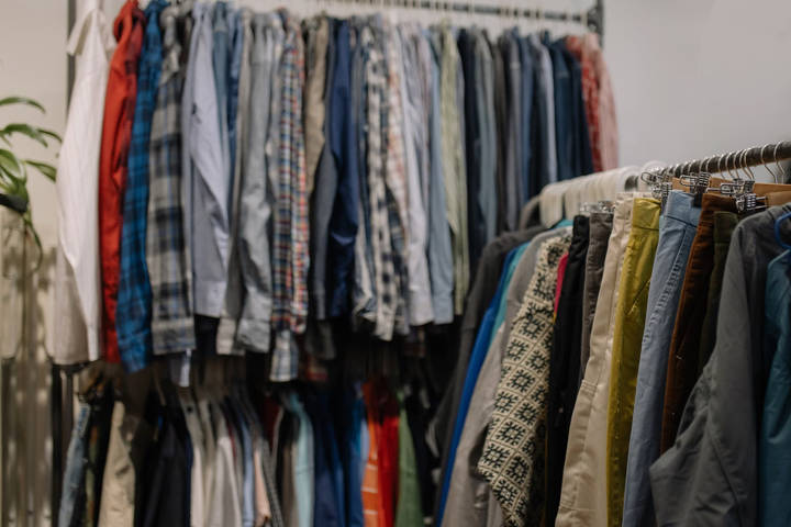 Racks of second-hand clothing in a shop