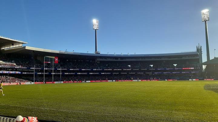 File image: Australian rules football stadium with empty oval, floodlights, and crowd seating
