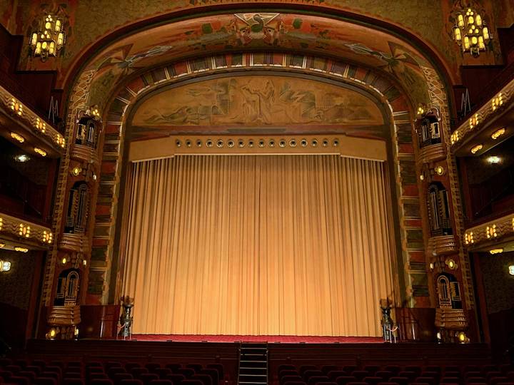 File image: Ornate Art Deco theatre interior with closed stage curtains