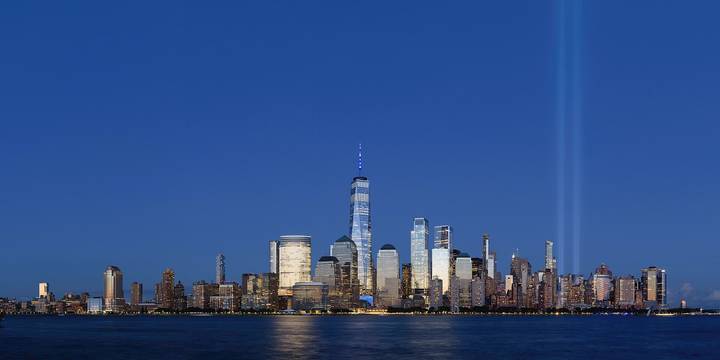 File image: A memorial light beam rising beside the Lower Manhattan skyline at dusk