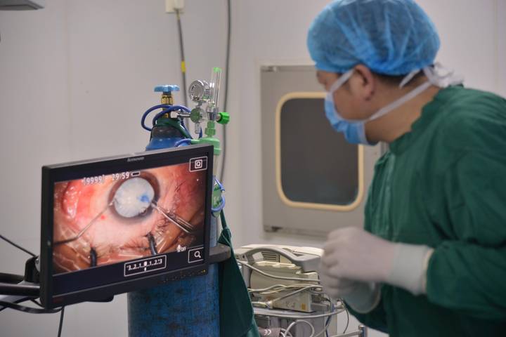 File image: Surgeon performing endoscopic procedure, monitoring internal tissue on screen