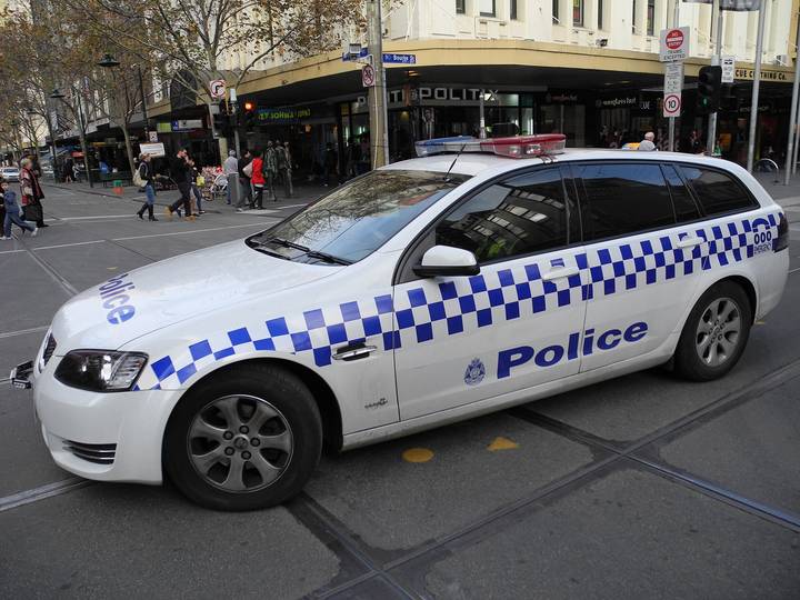 File image: Australian police car parked on a busy city street