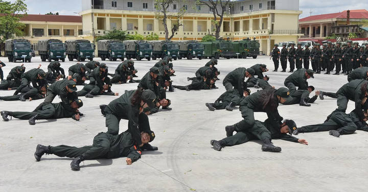 File image: Military personnel in uniform doing ground exercises on paved training area
