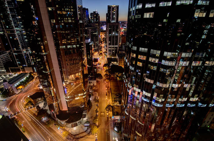 File image: Aerial night view of illuminated city business district skyscrapers