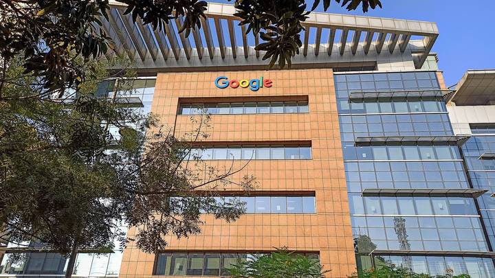 File image: Google office building with orange brick facade and prominent Google logo.
