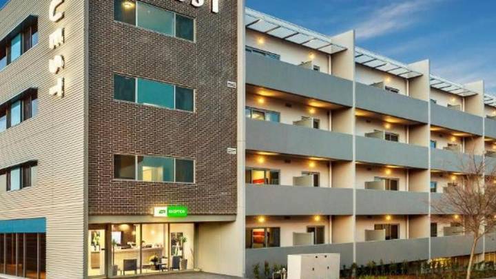 Contemporary mixed-use apartment hotel complex with ground floor retail