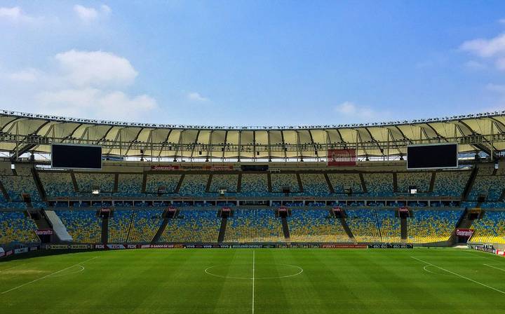 File image: Empty AFL stadium with yellow-blue seating and green field