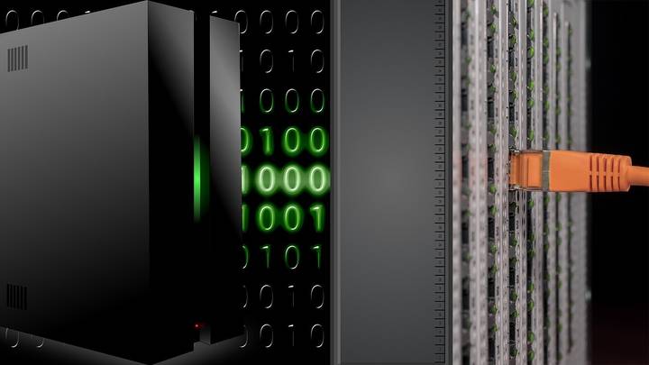 Server equipment with green binary code displayed on monitoring screen
