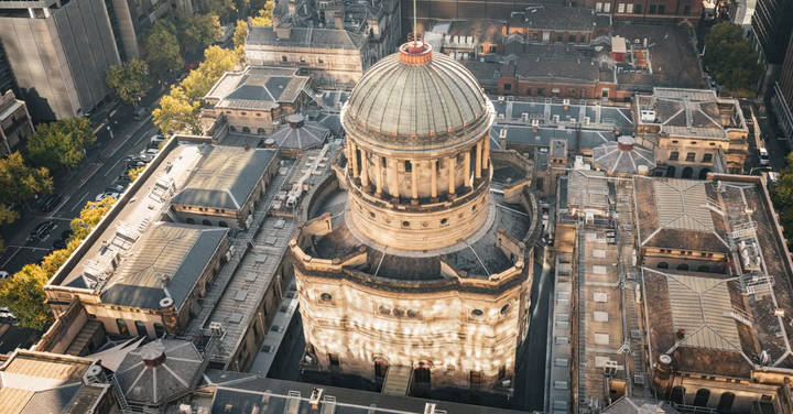 File image: Aerial photograph of classical domed building surrounded by urban streetscape.