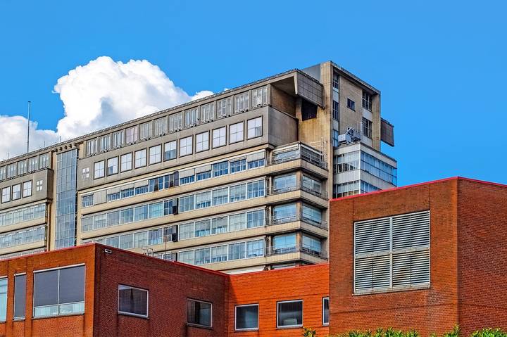 File image: Large concrete multi-storey building behind red brick foreground structures