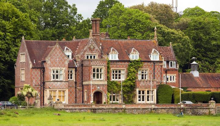 File image: Red brick Victorian country house with ivy and green grounds