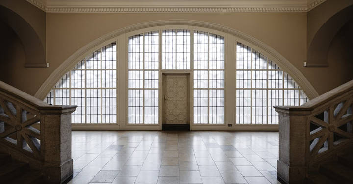 File image: Grand arched institutional interior with gridded skylight and symmetrical stone pillars