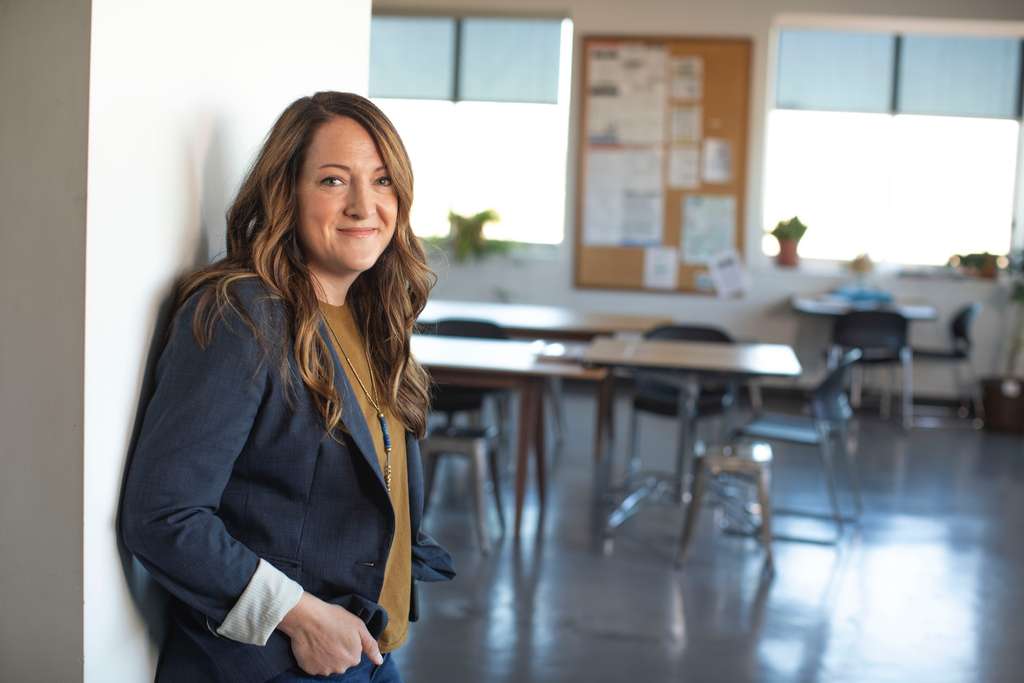 A woman mental health counselor in a suit jacket.