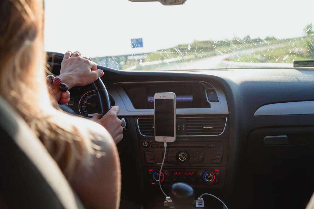 Young women driving a car.