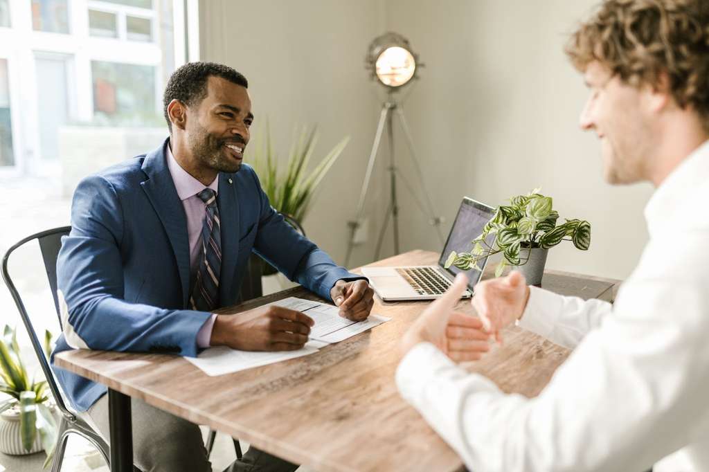 An insurance agent meeting with a client