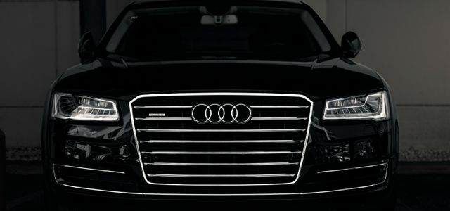 a black and white photo of an audi car