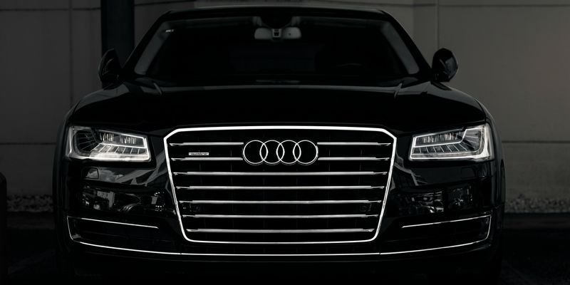 a black and white photo of an audi car