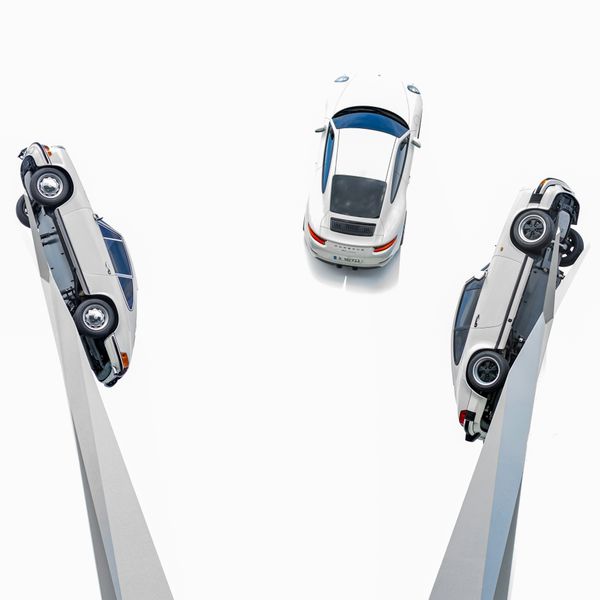 a car is shown from the top and bottom of a pair of scissor