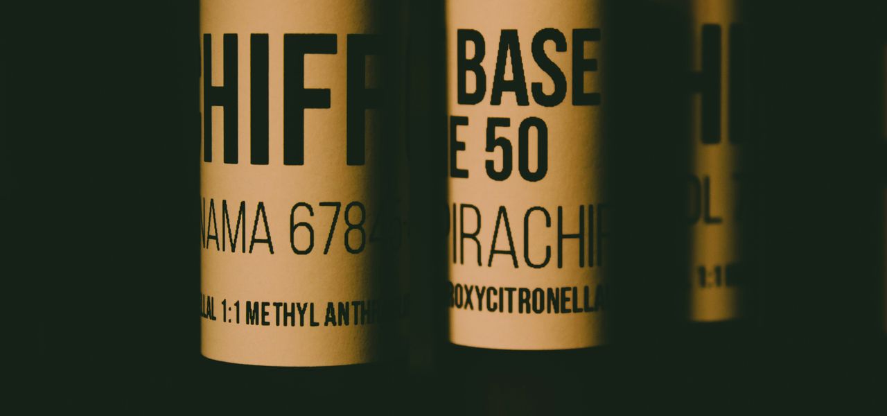 a close up of three bottles of wine