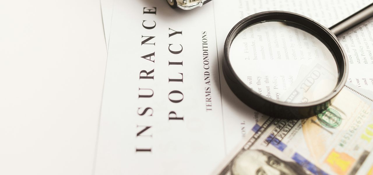 a magnifying glass sitting on top of a piece of paper