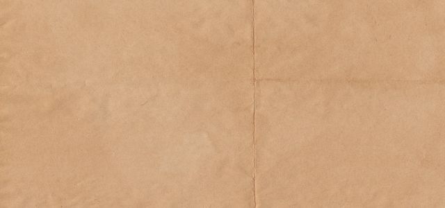 a piece of brown paper with a white background