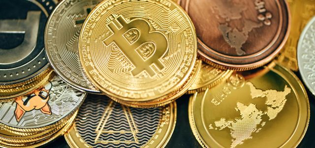 a pile of gold and silver bitcoins