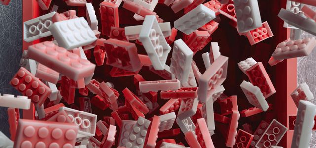 a pile of red and white legos laying on top of each other