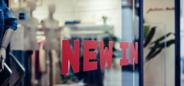 a window with a sign that says new in