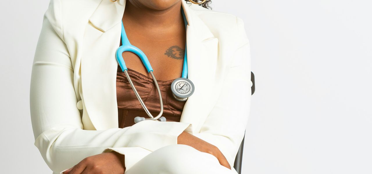 a woman in a white coat