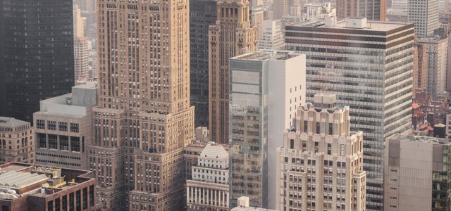 aerial view of city under cloudy sky during day time