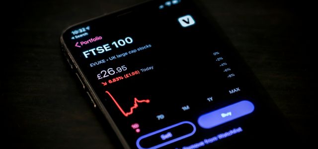 black android smartphone on brown wooden table