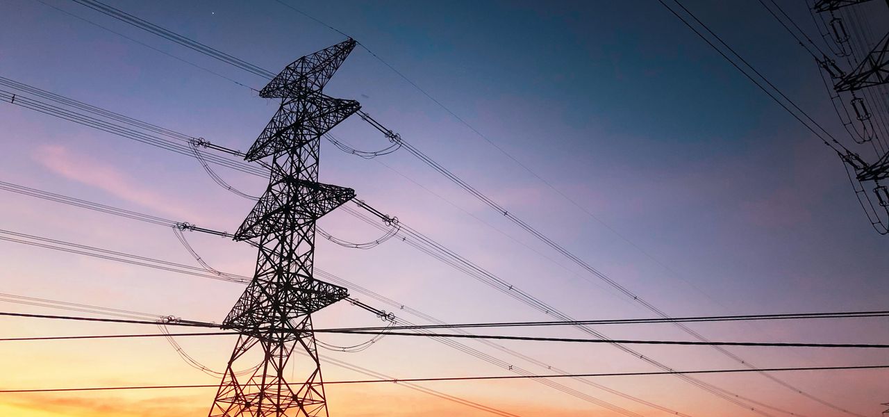 black electric tower under blue sky during sunset