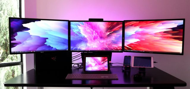 black flat screen tv on white wooden table