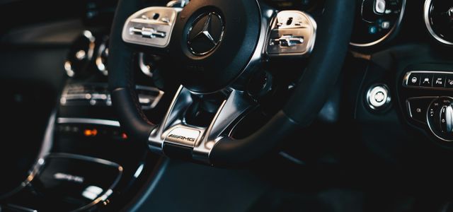 black Mercedes-Benz steering wheel