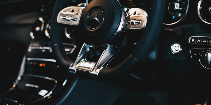 black Mercedes-Benz steering wheel